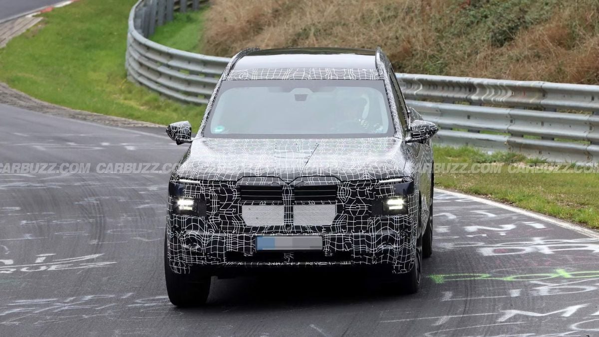 BMW iX7 prototype testing on Nürburgring track with reduced camouflage