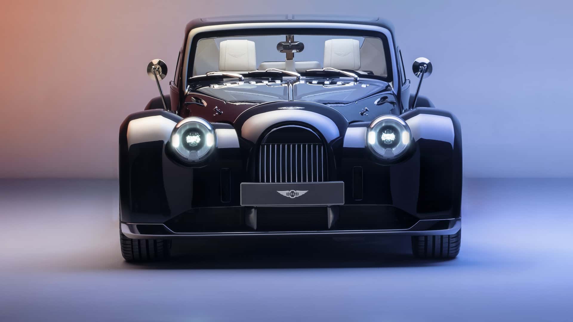 Morgan Plus Four sports car parked outdoors in natural light